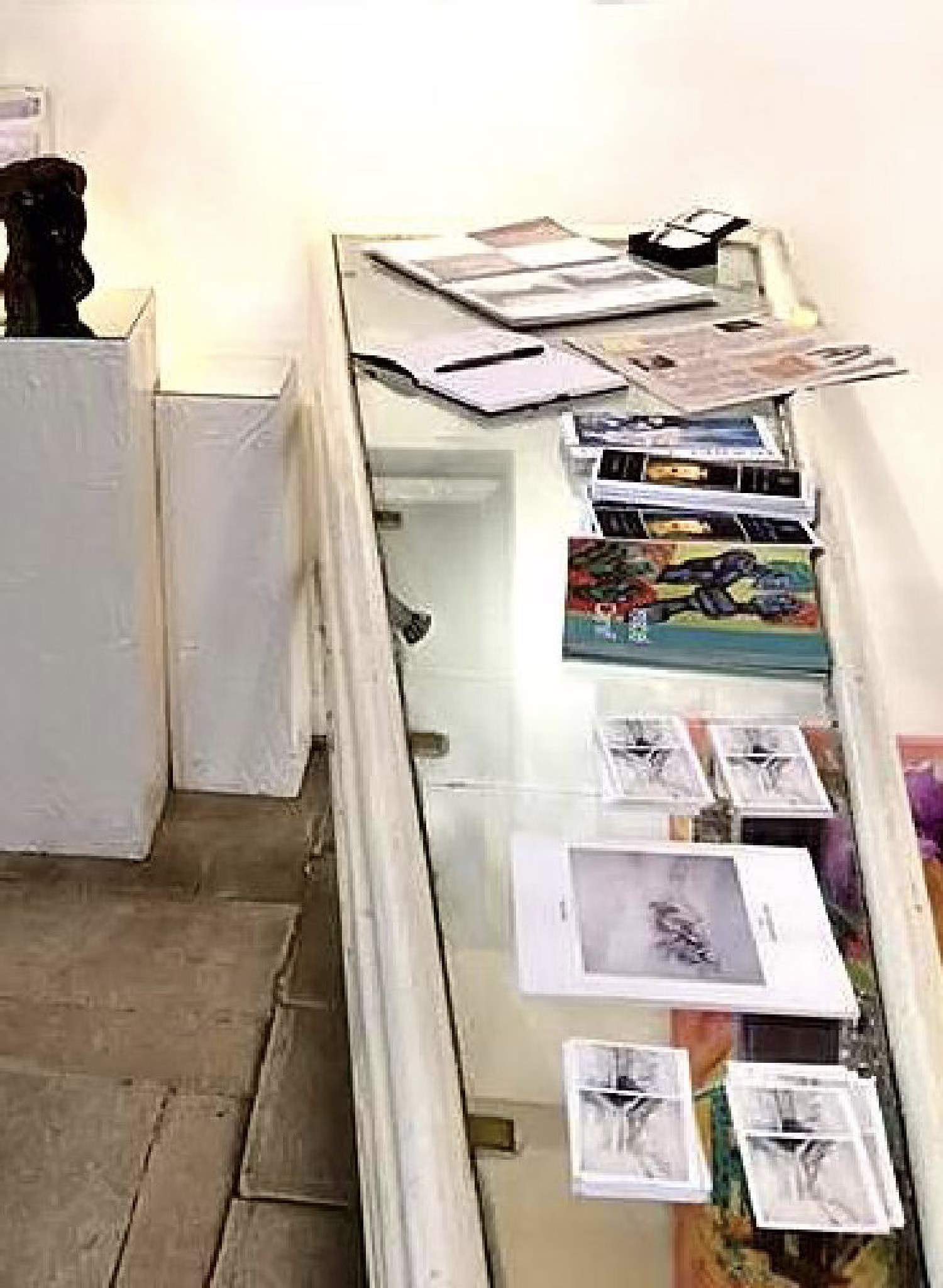 The Galerie Thuillier counter with the catalogues and cards of the “Paris 2015” artists