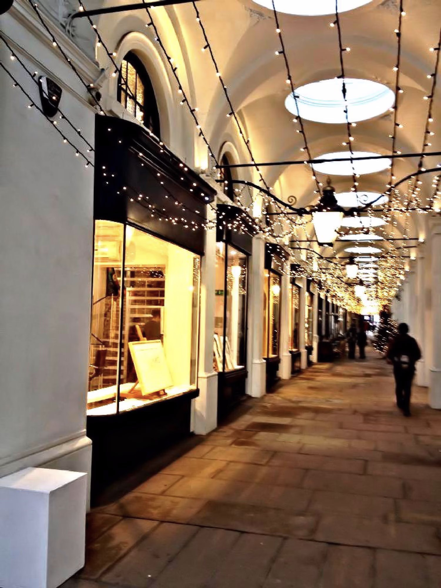 London’s Royal Opera Arcade with lights strung beneath the vaults, December 2014