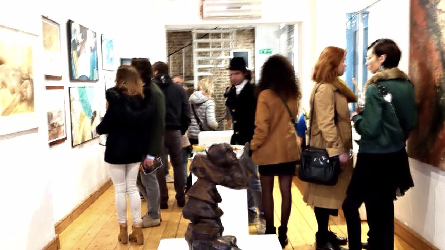 Visitors among the works of the Royal Arts Prize 2015 group exhibition