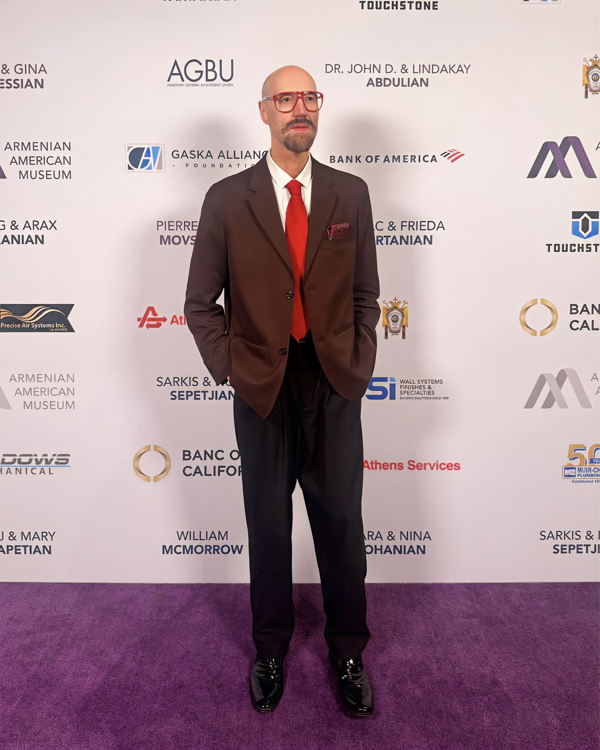 Raimondo Rossi full length on the red carpet of the Heritage Gala 2025, in front of the sponsors’ backdrop